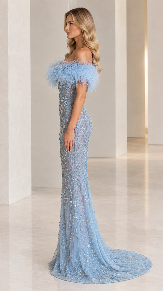 Side profile view of sky blue off-the-shoulder beaded formal dress with sweep train