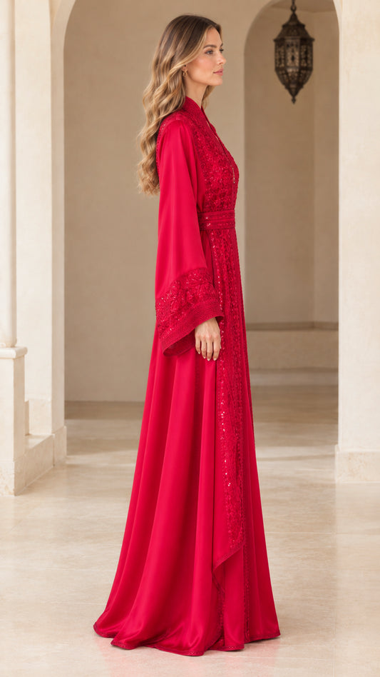 Side profile view of red embroidered floor-length kaftan dress