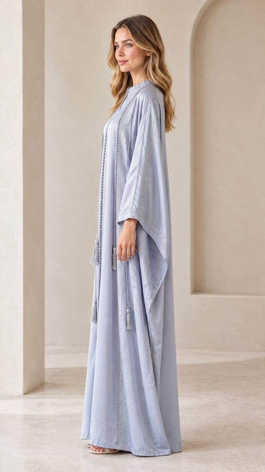 Side profile view of Dusty Blue batwing kaftan maxi dress showing fluid drape