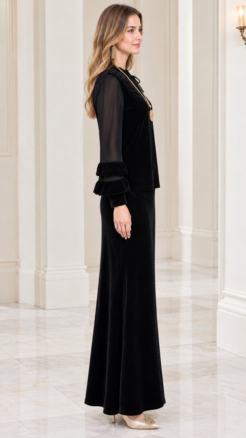 Side profile view of black velvet two-piece formal skirt set