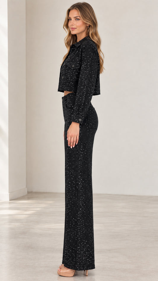 Side full-length view of black shimmering two-piece jacket and pants set