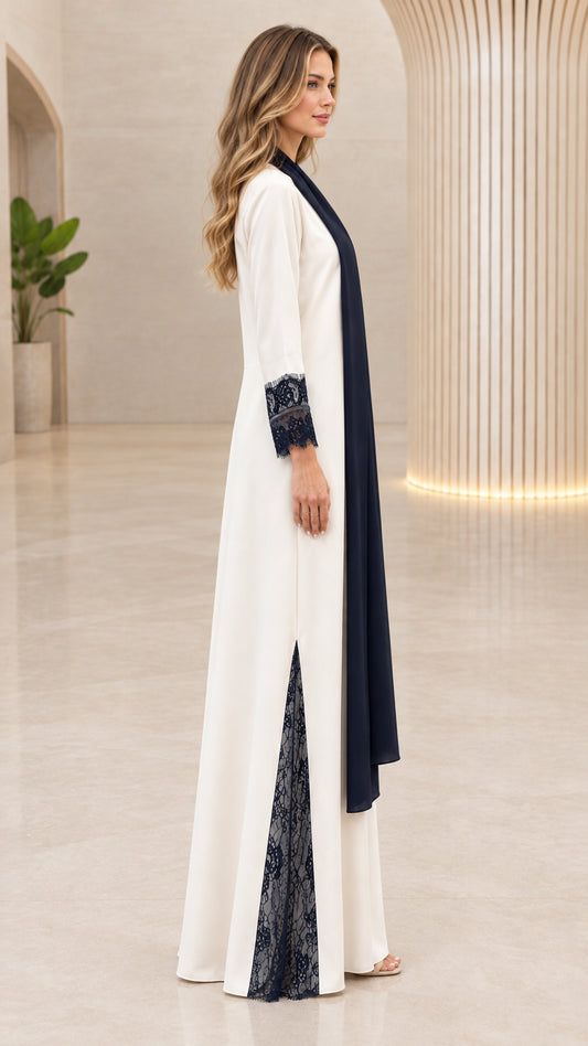 Side profile view of cream lace-trim maxi abaya showing side slit detail