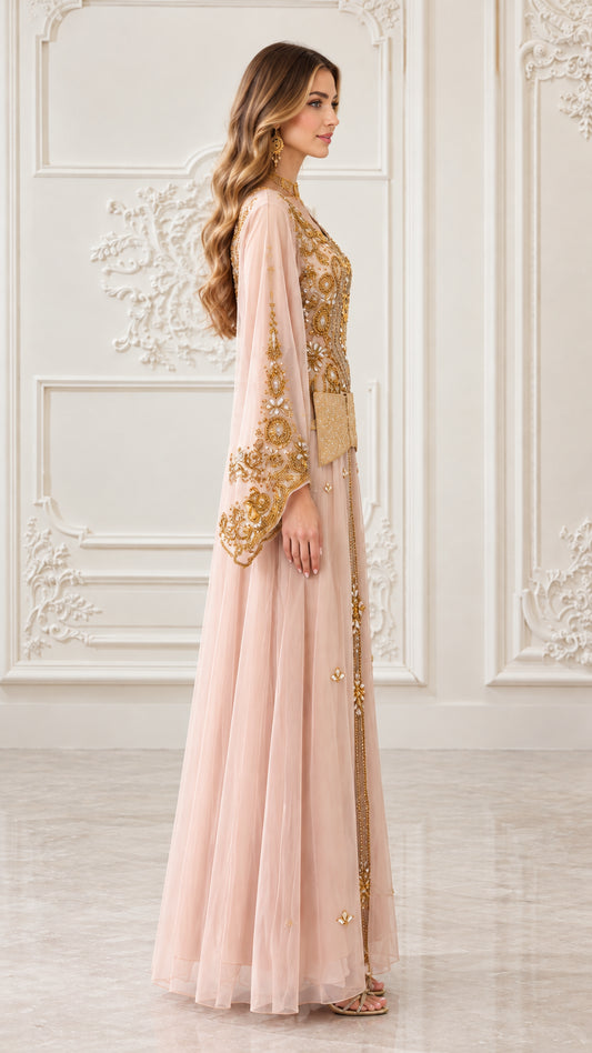 Side profile view of blush pink embroidered kaftan gown