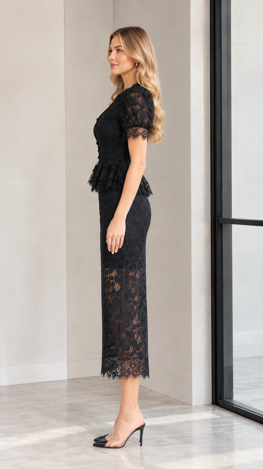 Side profile of model in black peplum lace midi dress