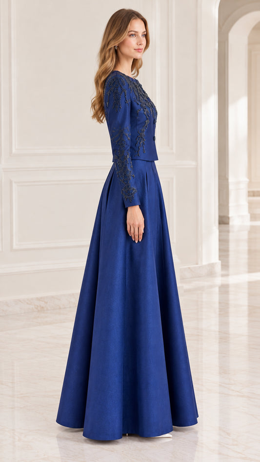 Side profile view of royal blue beaded formal dress showing structured tailoring and sleeve details