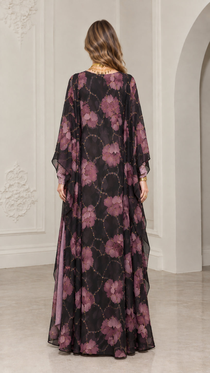 Back view of model showing full-length black floral kaftan gown