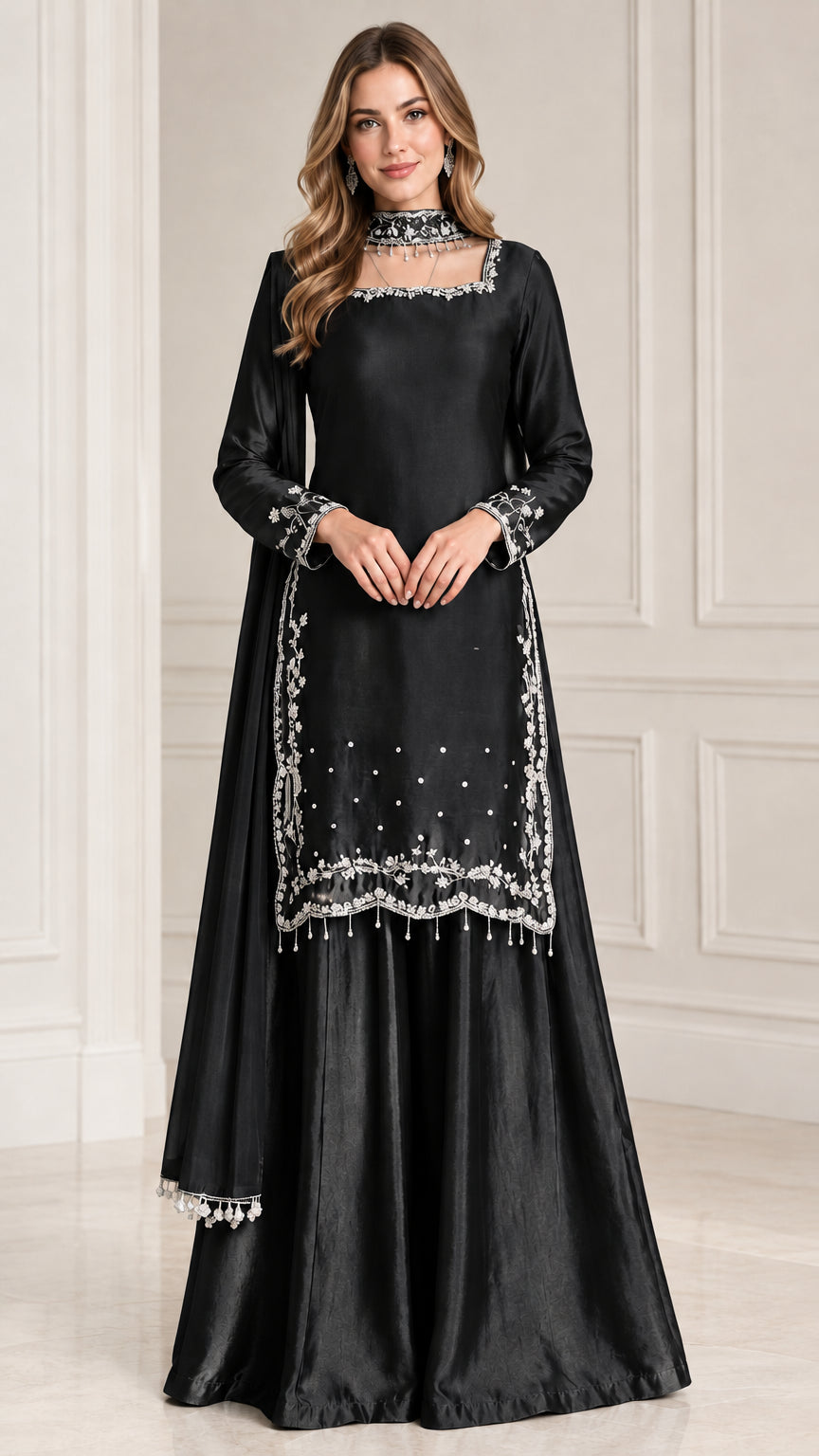 Front view of black embroidered satin sharara suit set