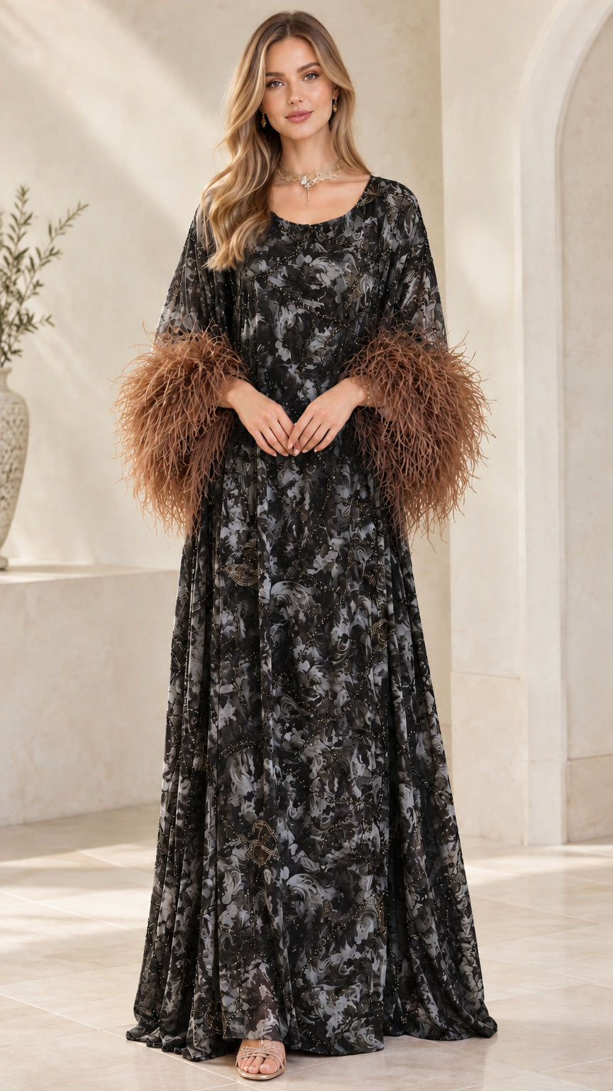 Model wearing black and grey printed kaftan dress with brown feather cuffs