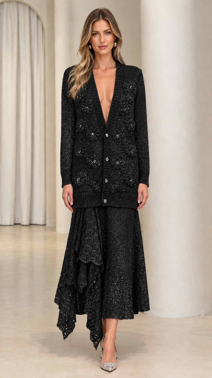 Model wearing black floral applique longline knit cardigan and matching lace midi skirt
