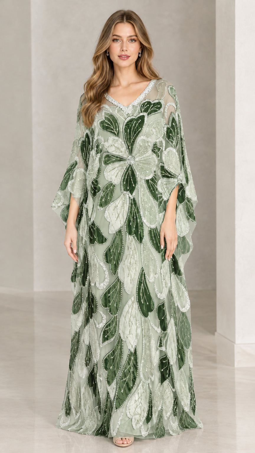 Front view of model wearing sage green beaded petal embroidered caftan dress