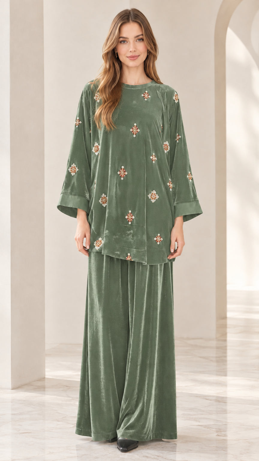 Front view of model wearing sage green embroidered velvet two piece set