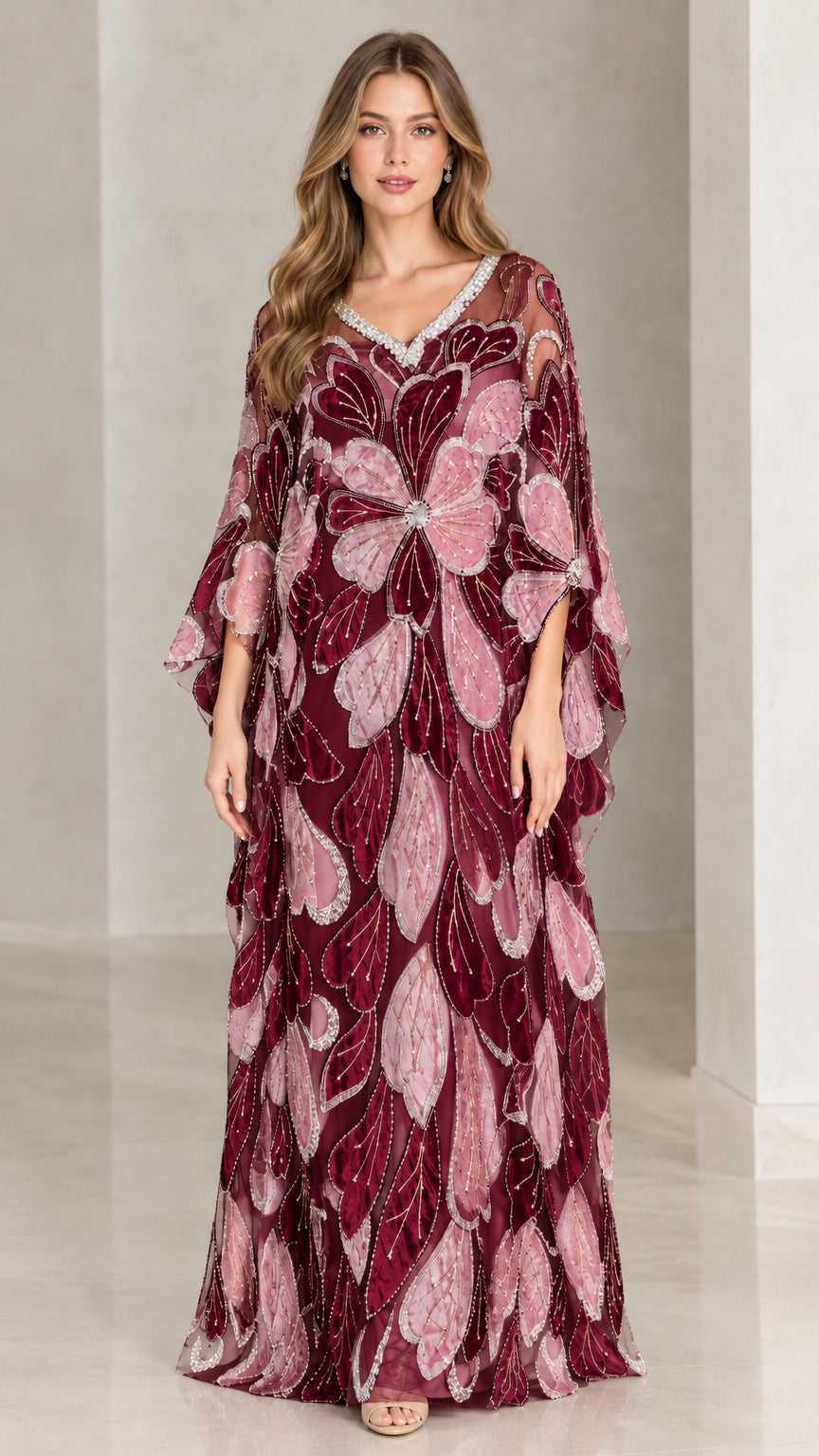 Front view of model wearing burgundy and plum embroidered evening kaftan gown