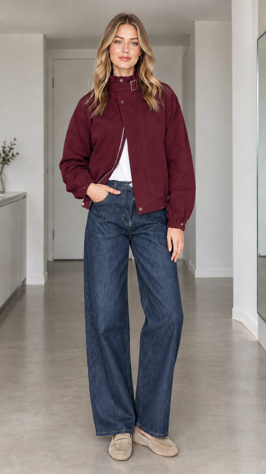 Front view of model wearing burgundy wine high-collar buckle bomber jacket