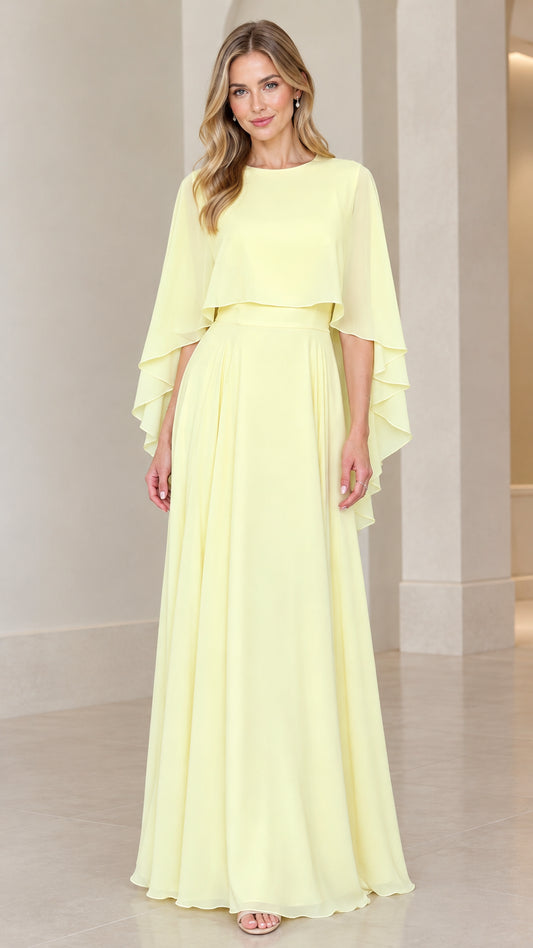 Front full-length view of model wearing pale yellow chiffon capelet evening maxi dress