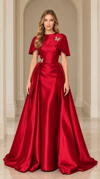 Full-length front view of red satin capelet evening gown with crystal butterfly accents