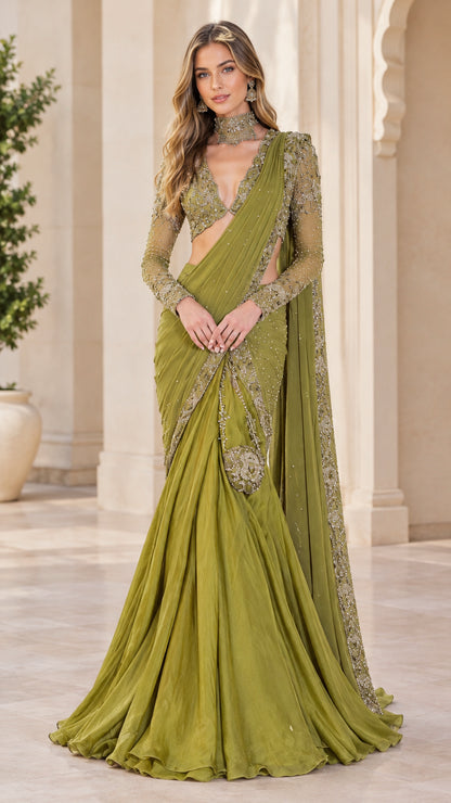 Front full-length view of woman wearing an olive green embellished pre-draped saree gown