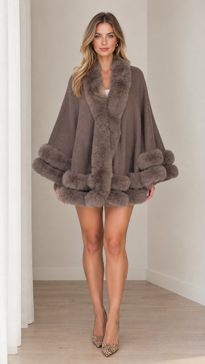 Front view of model wearing taupe faux fur trim cape coat with heels