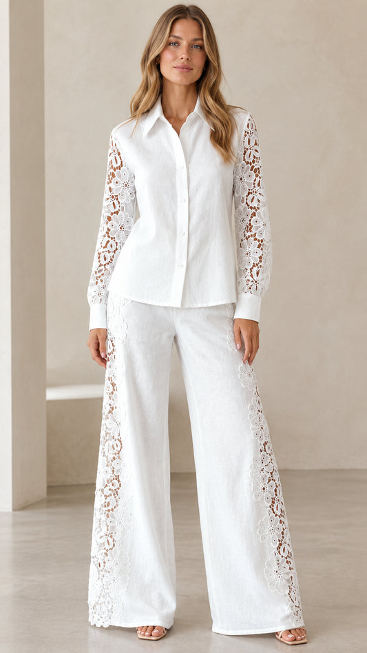 Front view of woman wearing white floral lace button-up shirt and wide-leg trousers two-piece set
