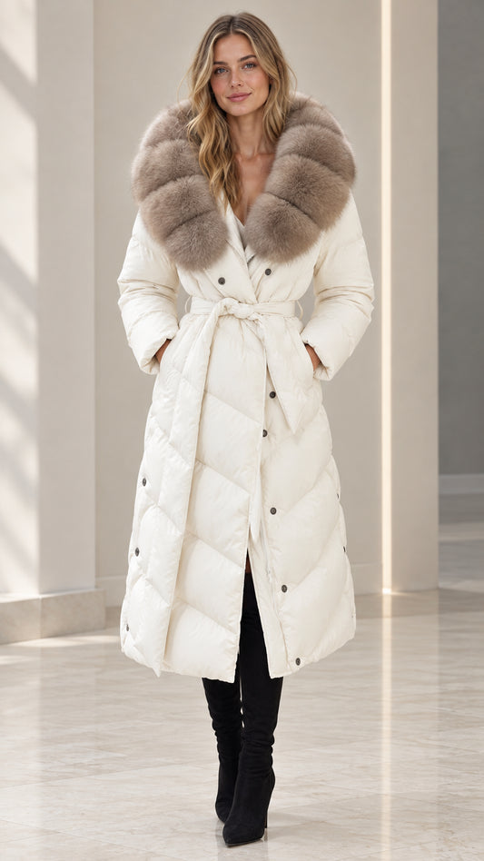 Front full-length view of woman wearing off white belted maxi puffer coat with plush fur collar