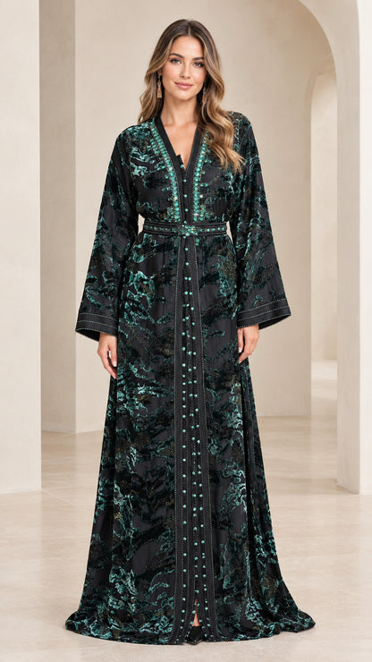 Front view of woman wearing emerald green burnout velvet embroidered kaftan dress with belt