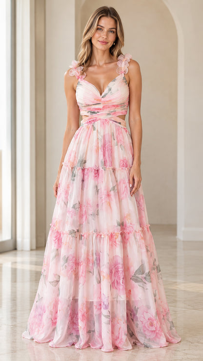 Front view of woman wearing pink floral cutout tiered maxi dress with 3D floral shoulder straps