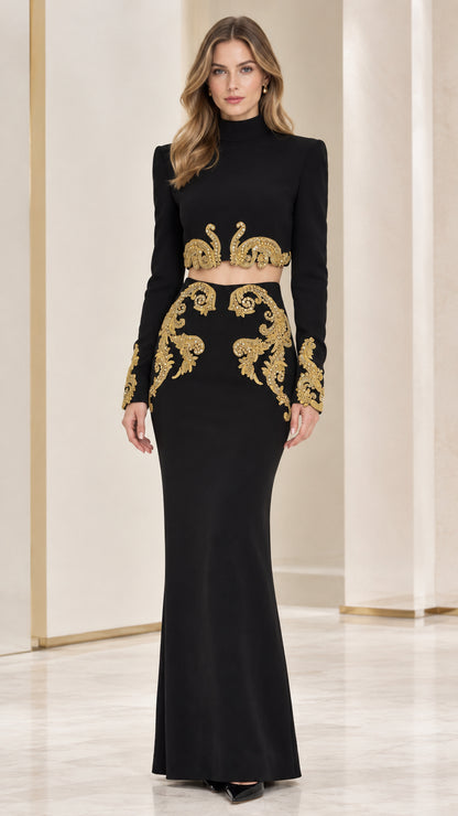 Front full-length view of woman wearing Black two-piece formal dress with gold embroidery