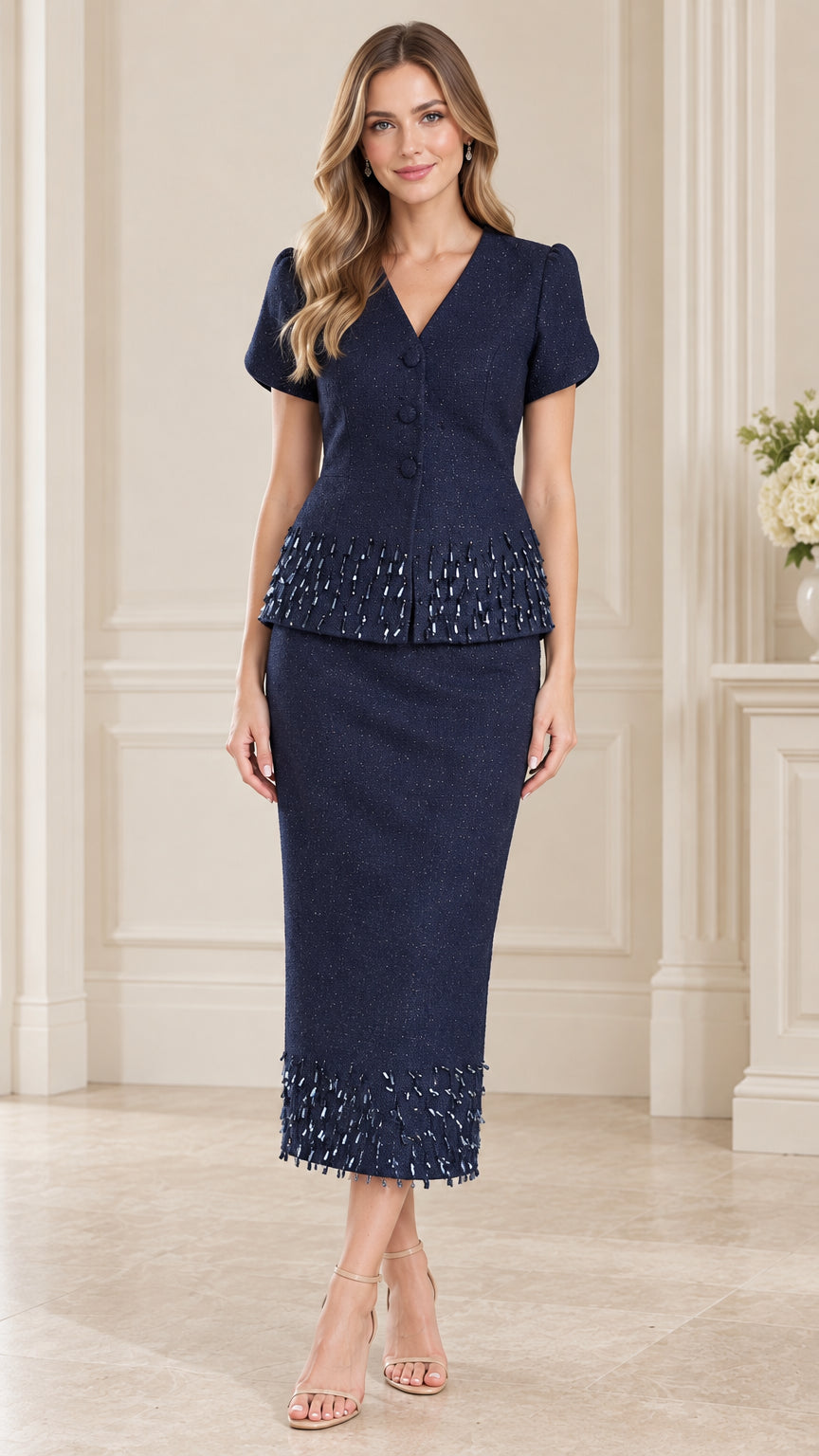 Front full-length view of woman wearing navy blue beaded trim short sleeve skirt suit set