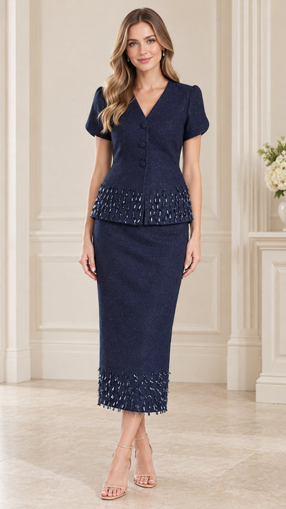 Front full-length view of woman wearing navy blue beaded trim short sleeve skirt suit set