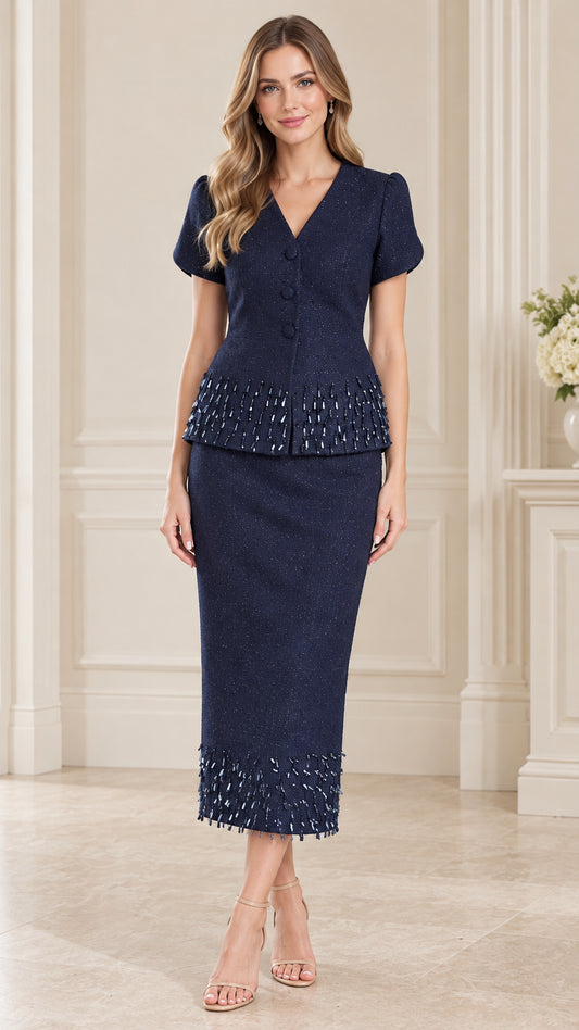Front full-length view of woman wearing navy blue beaded trim short sleeve skirt suit set