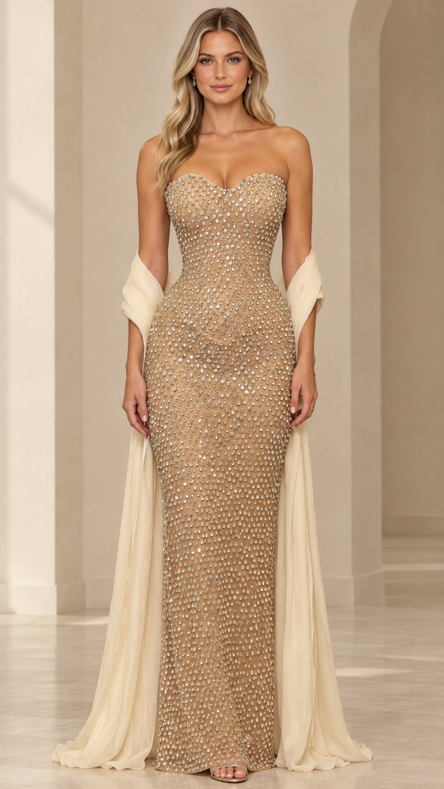 Front view of model wearing champagne strapless rhinestone sweetheart evening gown with flowing matching shawl