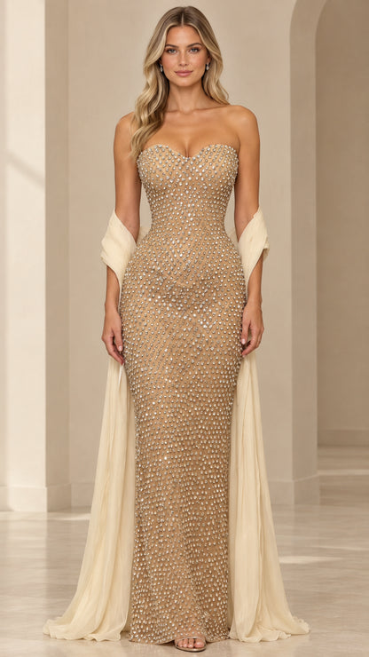 Front view of model wearing champagne strapless rhinestone sweetheart evening gown with flowing matching shawl