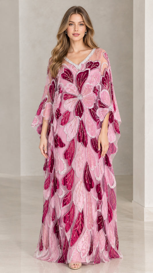 Front view of model wearing pink floral beaded kaftan maxi dress with crystal V-neckline