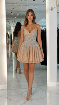 Front view of model wearing Champagne rhinestone sweetheart strapless mini dress