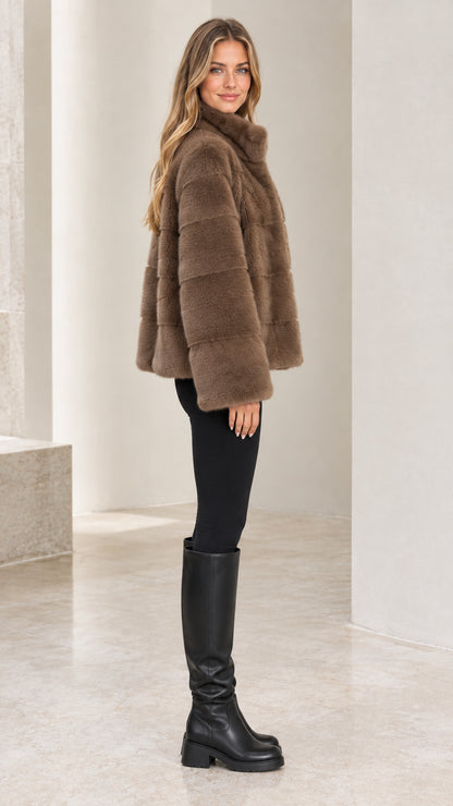 Side profile view of model wearing Mocha Brown plush faux fur jacket