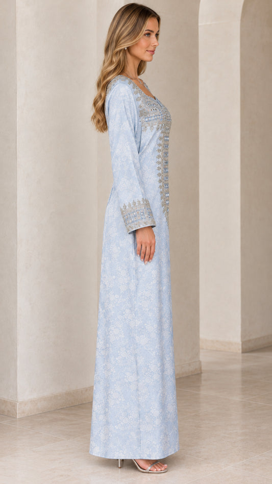 Side view of woman wearing light blue long sleeve embellished maxi dress