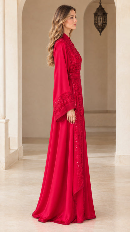 Side profile view of red embroidered floor-length kaftan dress