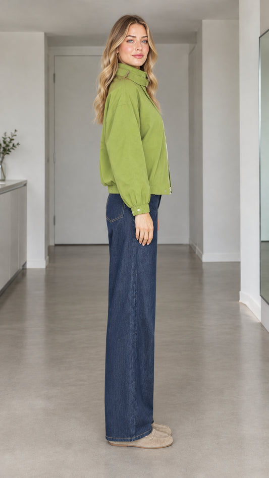 Side angle view of model wearing green utility zip-up jacket