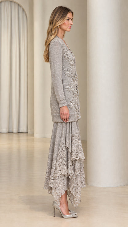 Side view of model wearing silver grey knit cardigan and ruffled lace midi skirt set