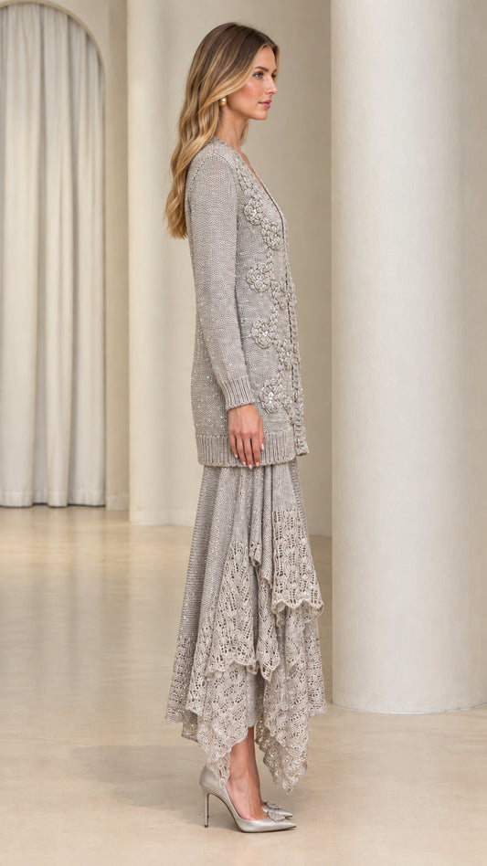 Side view of model wearing silver grey knit cardigan and ruffled lace midi skirt set