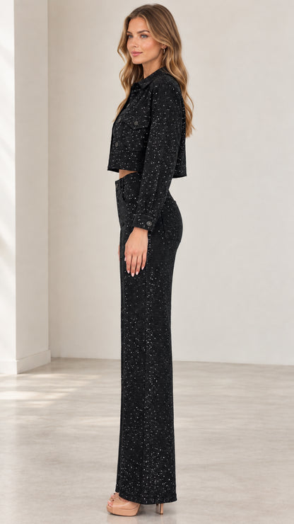 Side full-length view of black shimmering two-piece jacket and pants set