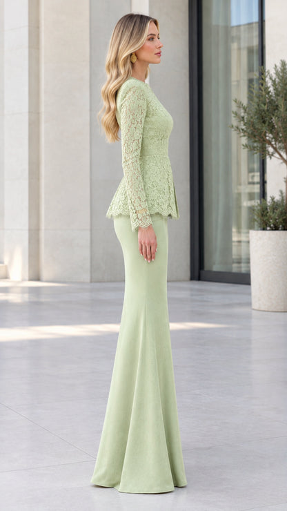 Side profile view of woman wearing sage green peplum gown with mermaid skirt