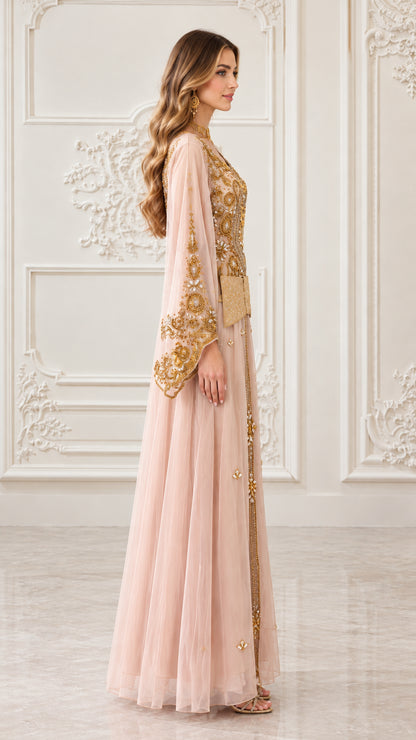 Side profile view of blush pink embroidered kaftan gown