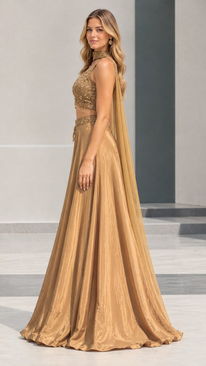 Side profile of woman in gold embellished formal crop top and maxi skirt set