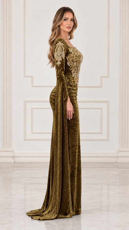 Side profile view of olive green velvet evening gown showing dramatic sleeve length and silhouette