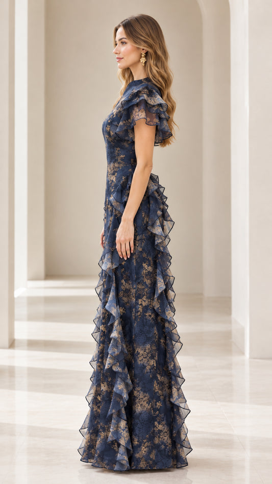 Side profile of model in Navy Blue floral maxi dress showing ruffled hip cascade