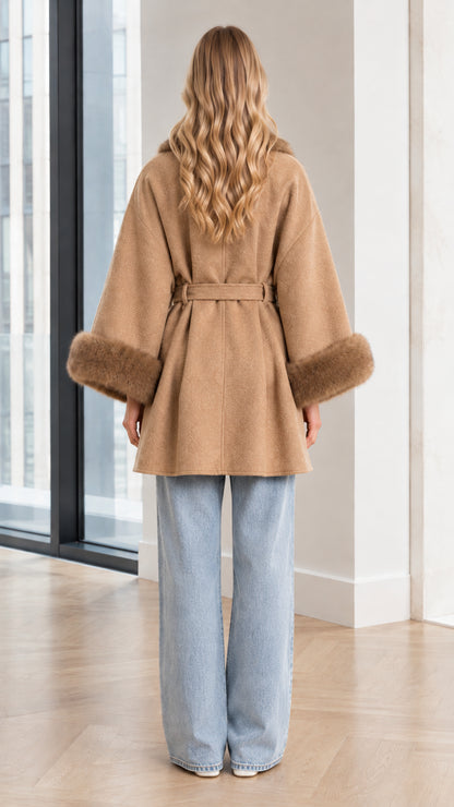 Back view of model wearing Camel belted cape coat with wide sleeves