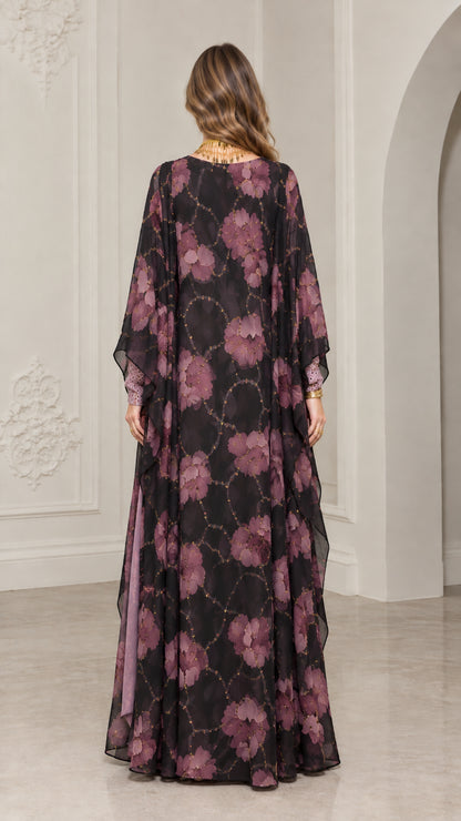 Back view of model showing full-length black floral kaftan gown