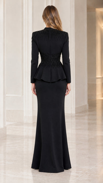 Back view of model in black peplum evening gown set showing beaded back collar detail