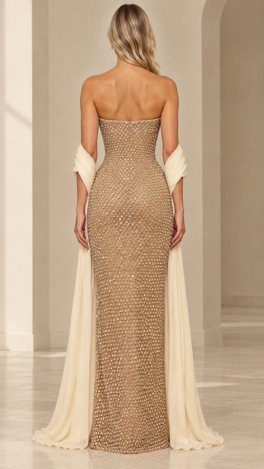 Back view of champagne embellished strapless floor-length evening dress