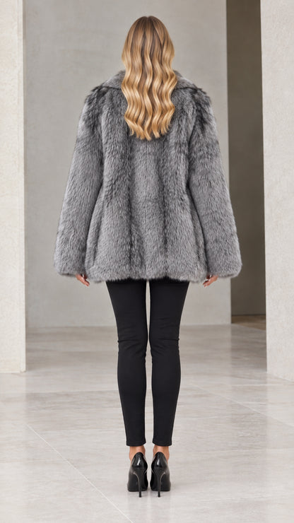 Back view of woman wearing silver grey plush faux fur coat